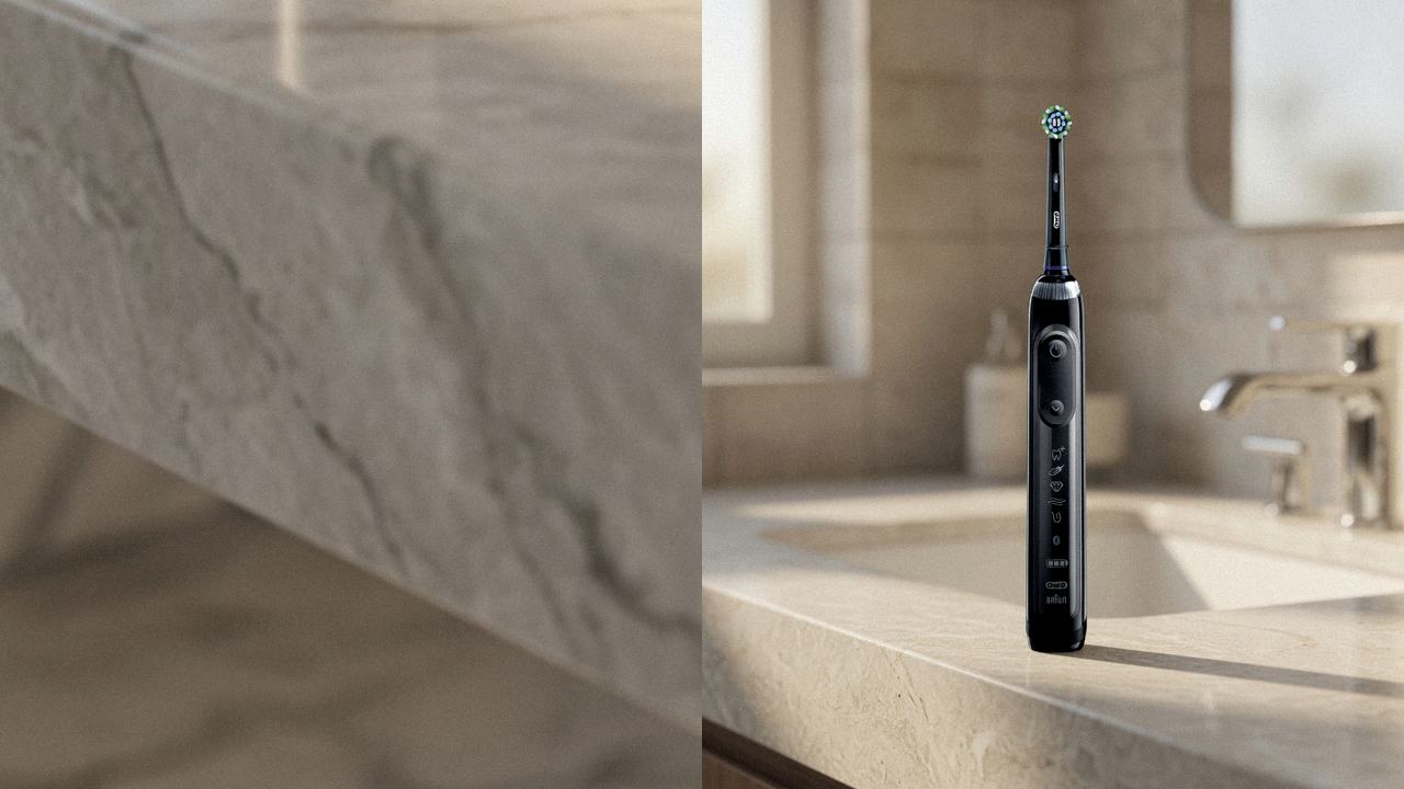 Oral-B iO Series 5 beside Oral-B Genius X on the same bathroom counter